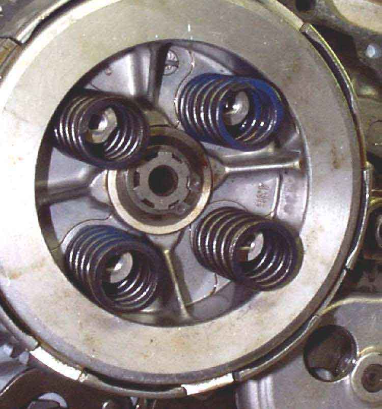 clutch with compression springs popping out of its body